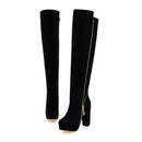 Black knee-high boots with gold zipper on a white background, Obroi