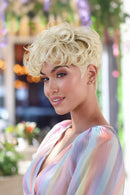 Woman with styled blonde hair in an outdoor setting, Obroi