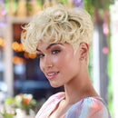 Woman with styled blonde hair in an outdoor setting, Obroi