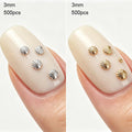 Two close-up views of a fingernail displaying small shell-shaped nail art pieces. The left shows silver shell pieces, and the right shows gold shell pieces, both on a glossy nude nail, Obroi