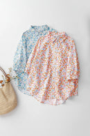 Two floral shirts, one blue and one multicolor, on a light gray background with a woven bag, Obroi