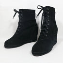 Black lace-up boots on a white background with 'Obroi' branding.