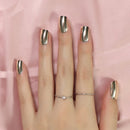 Hand with polished nails and minimal jewelry on a pink fabric background, Obroi