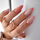 Hand with pink gradient nails and gold rings on a white background, Obroi