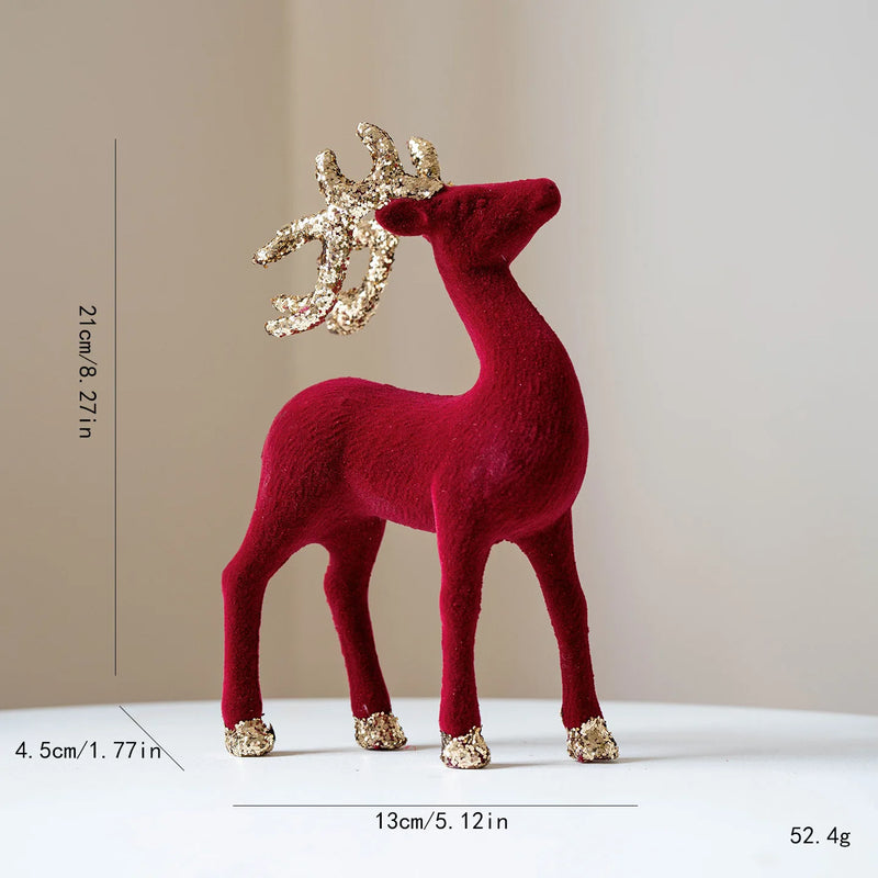 Red deer figurine with gold antlers and feet on a beige , Obroi