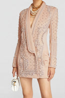 Beige embroidered blazer worn by a person on a light gray background, Obroi
