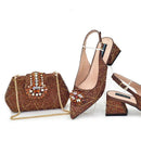 Brown shoes and matching handbag with embellishments on a white background, Obroi