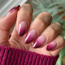 Close-up of a hand with pink and purple gradient nails, Obroi