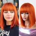 Side-by-side comparison of a person with orange hair and a mannequin head with orange hair, Obroi