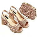 A matching women's evening wear set from Obroi, featuring a pair of rose gold high-heeled sandals with rhinestone embellishments and a matching rhinestone-encrusted clutch bag with a gold chain strap, displayed on a clean white background, Obroi