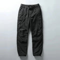 Dark gray cargo pants on a light gray background, Obroi