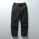 Dark gray cargo pants on a light gray background, Obroi