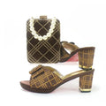 Pair of brown and gold patterned shoes with matching handbag on a white background, Obroi
