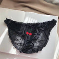 Black lace lingerie with cherry embroidery on a white surface, Obroi