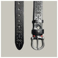 Black leather belt with intricate designs on a gray background, Obroi