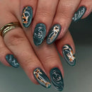Nails with artistic designs of dogs on a teal background, Obroi