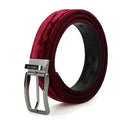 A rolled-up men's belt from Piergitar Collection, featuring a deep burgundy velvet-textured exterior, a black interior lining, and a polished silver-tone metal buckle, Obroi