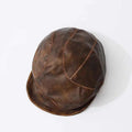Brown leather cap on a white background, Obroi