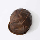 Brown leather cap on a white background, Obroi