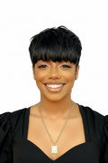 Woman with a short black hairstyle wearing a black top and gold necklace on a white background, Obroi
