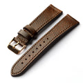 Brown leather watch strap with gold buckle on a white background, Obroi