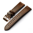 Brown leather watch strap with gold buckle on a white background, Obroi