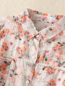 Floral patterned shirt with orange and pink flowers on a light background, Obroi
