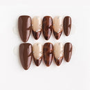 Set of brown and beige nail tips with a slight difference on a white background, Obroi