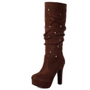 Brown platform boot with decorative buttons on a white background, Obroi