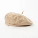 Beige beret on a white background, Obroi