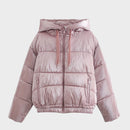 Pink puffer jacket with a hood on a white background, featuring the brand 'Obroi.