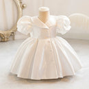 White dress on a mannequin with a decorative background, Obroi