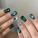 Nails with green and black nail polish and decorative patterns on a neutral background, Obroi