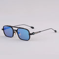 Sunglasses with blue lenses and black frames on a light gray background, Obroi