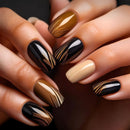 Close-up of hands with black, gold, and beige marbled nail polish on a dark background, Obroi