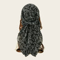 Black floral headscarf on a plain background, Obroi