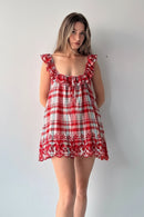 Red and white checkered dress with floral details on a plain background, Obroi