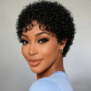 Woman with styled black hair wearing a light blue top against a neutral background, Obroi