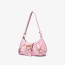 Pink handbag with gold accents on a light gray background, Obroi