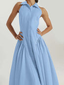 A sleeveless light blue collared dress with a structured bodice and full skirt, shown on a model against a plain light background, Obroi