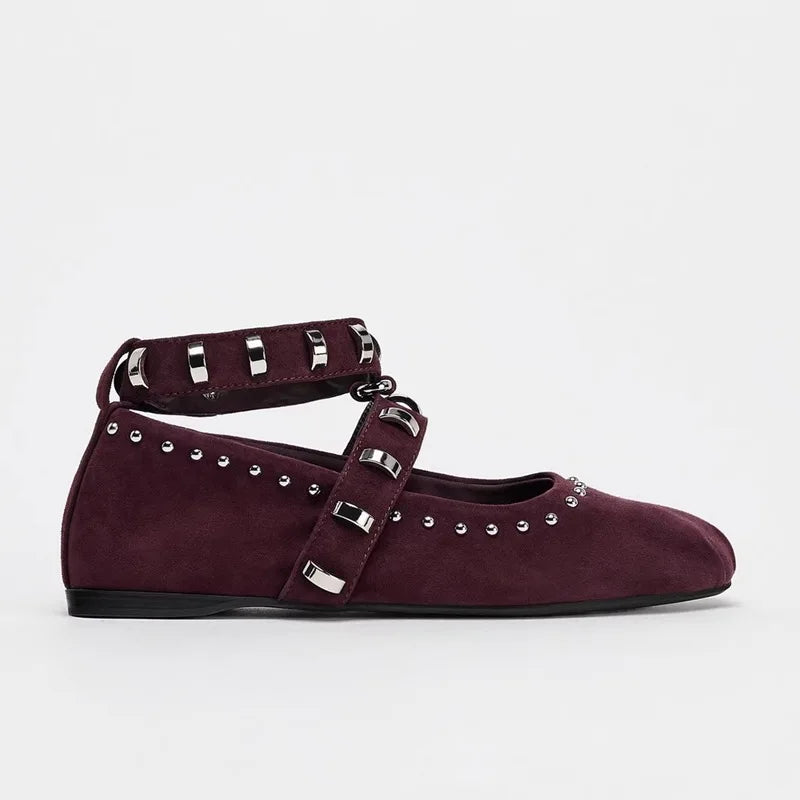 Burgundy flat shoes with silver straps and studs on a white background, Obroi