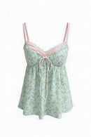 A light green floral camisole nightgown with pink lace trim and thin pink straps, featuring a front tie closure. The brand name 'Kimotimo' is displayed in the top left corner on a plain white background, Obroi