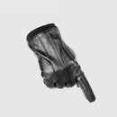 Black leather glove on a light gray background with 'Obroi' branding.