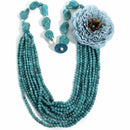 Turquoise beaded necklace with a large blue flower pendant on a white background, Obroi