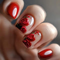Close-up of a hand with red rose nail art on a blurred background, Obroi