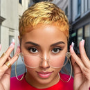 Woman with gold hair and large hoop earrings holding glasses, wearing a red top, Obroi