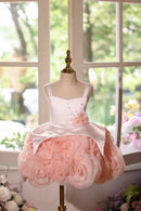 White and pink dress on a mannequin in front of a window with flowers, Obroi