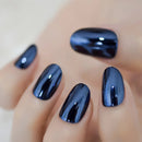 Close-up of a hand with dark blue nail polish on a blurred background, Obroi