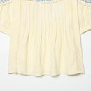 Light yellow blouse with embroidery on a white background, Obroi