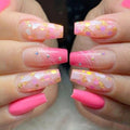 Obroi Close-up of hands with pink and gold glittery nail art